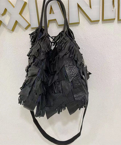 Damens elegant fårskinn crossbody-veske med frynser og indre lommer