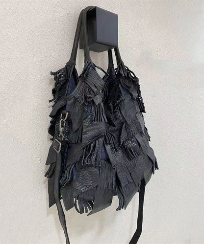 Damens elegant fårskinn crossbody-veske med frynser og indre lommer