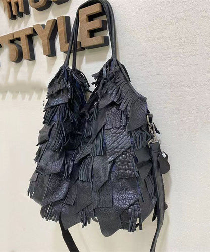 Damens elegant fårskinn crossbody-veske med frynser og indre lommer